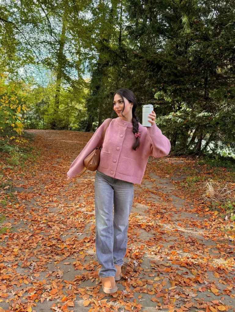 Dusty pink button cardigan styled with gray straight-leg jeans, neutral shoes, and a tan shoulder bag for a casual autumn outfit.