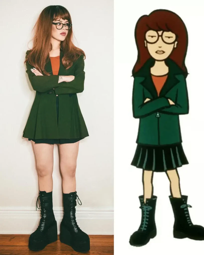 Woman wearing a dark green blazer, rust-colored top, black mini skirt, glasses, and chunky black boots for a smart cartoon-inspired costume.
