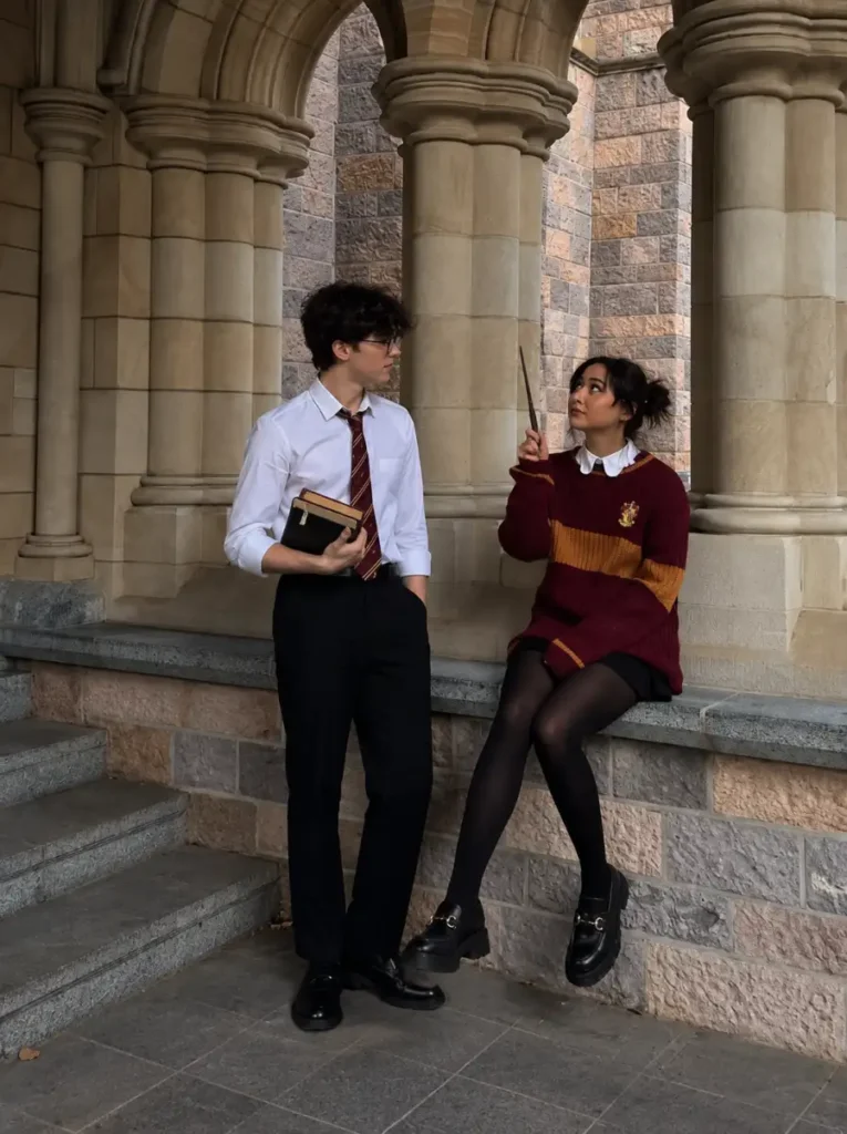 Harry Potter and Hermione couple costume with Gryffindor colors, wand, books, tie, and school-inspired outfits.