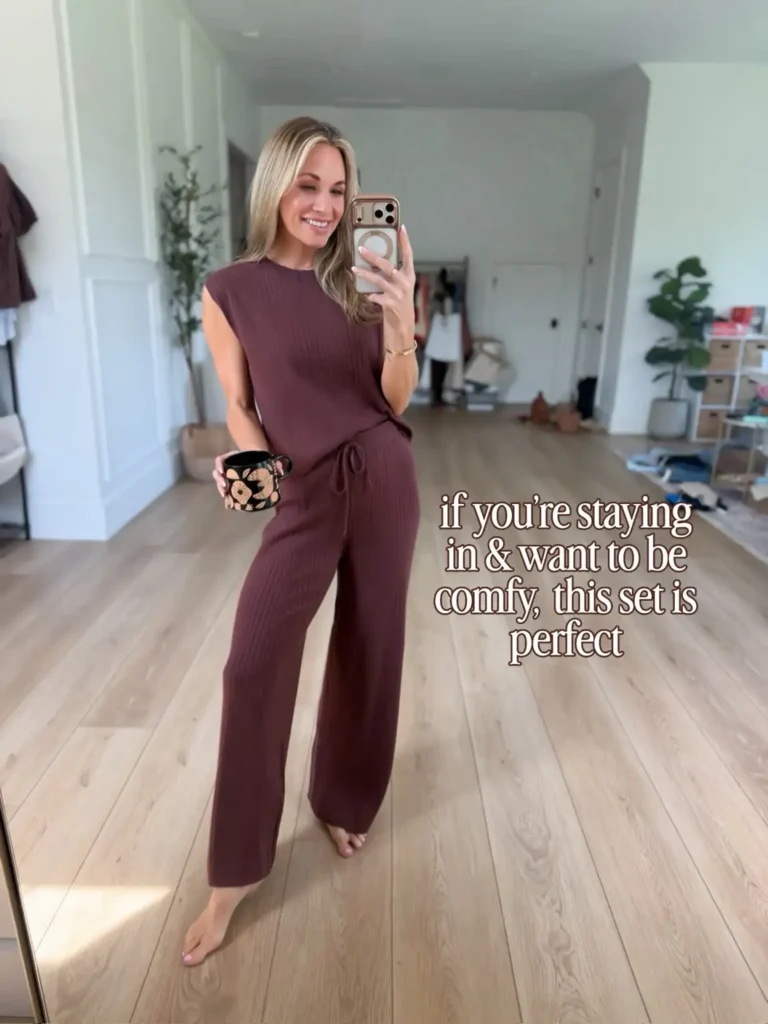 Woman wearing a deep plum ribbed matching lounge set with a sleeveless top and drawstring wide-leg pants for a relaxed and comfortable Friendsgiving celebration at home.
