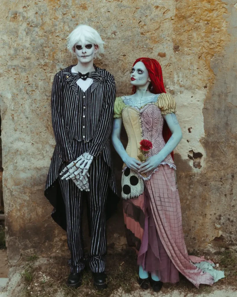Jack and Sally couple Halloween costume with pinstripe suit, patchwork dress and character makeup