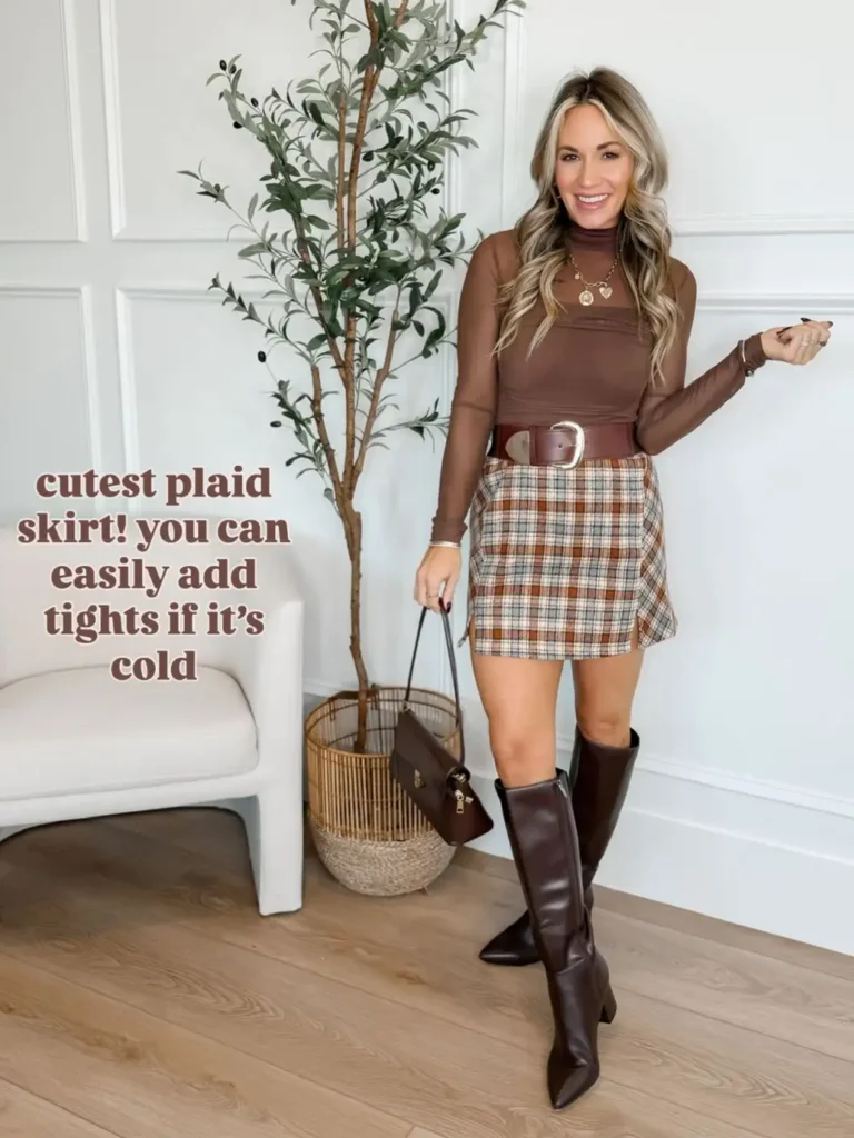 Woman wearing a brown plaid mini skirt with a fitted mocha long-sleeve top, wide buckle belt, chocolate knee-high boots, and brown handbag for Friendsgiving.