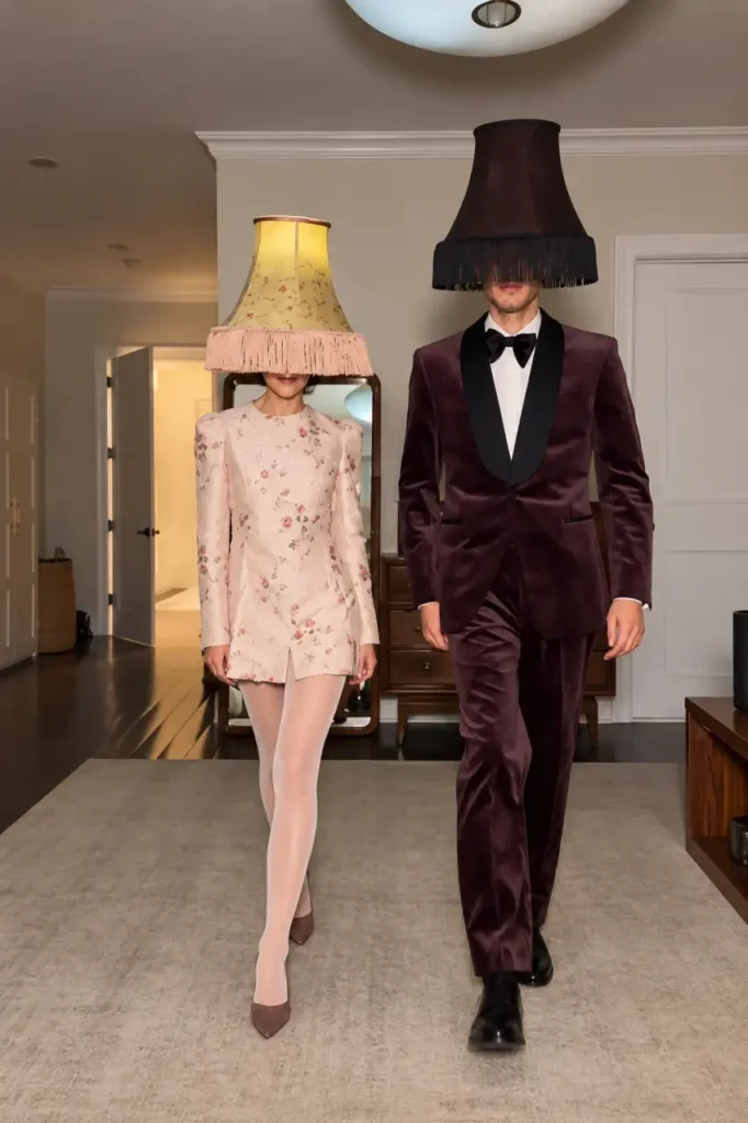 Creative couple Halloween costume featuring matching vintage lampshade headpieces and dressy outfits.