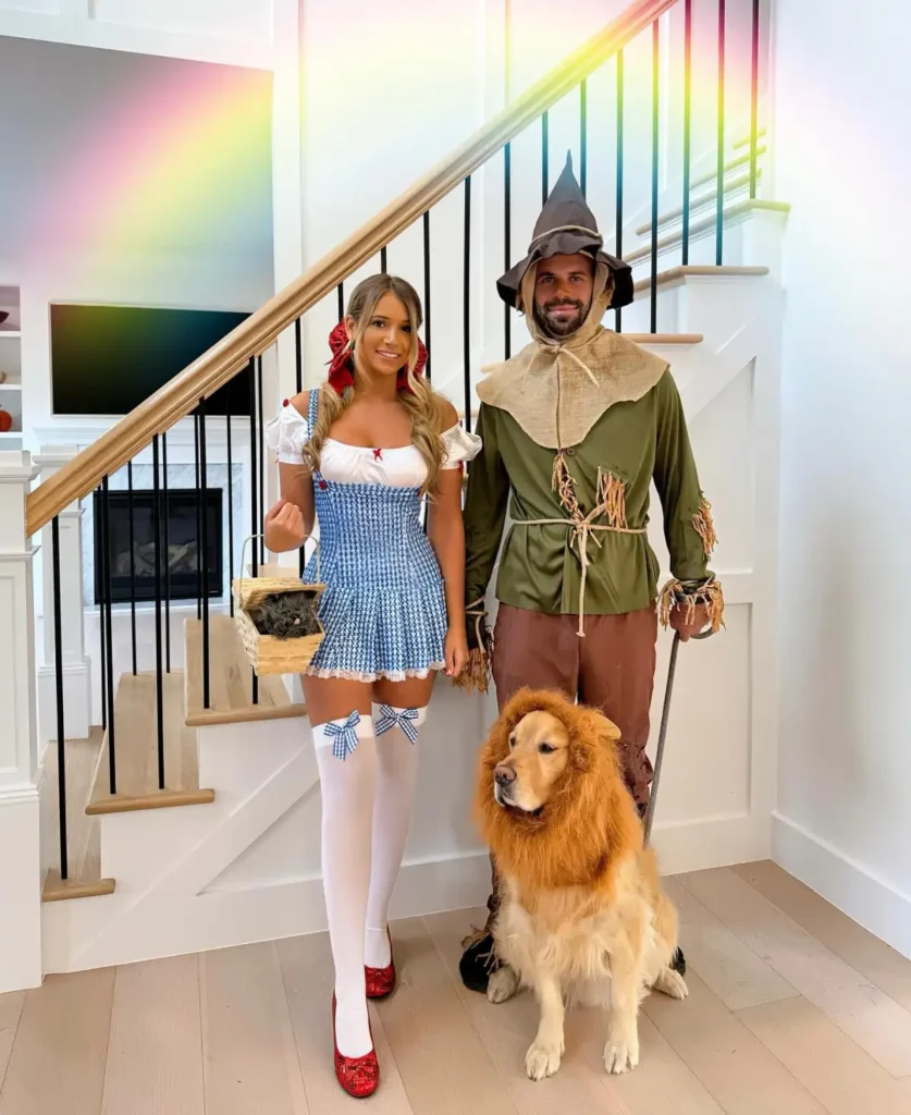 Dorothy and Scarecrow couple Halloween costume with blue dress, scarecrow outfit and dog dressed as lion
